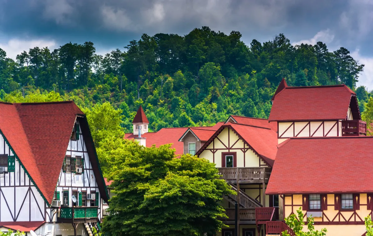 Bavarian-style buildings of Alpine Helen, Georgia with green hills