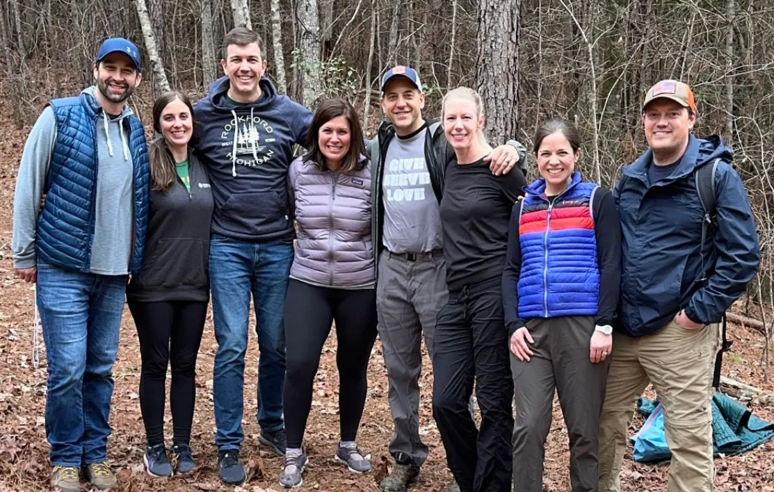 Group of Valentine's Getaway attendees on a wooded trail hike